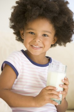 bigstockphoto_Young_Girl_Indoors_Drinking_Mi_4135560
